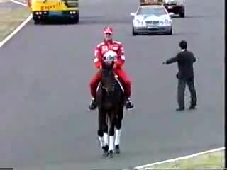 Michael Schumacher riding a horse on parade lap before the race at Suzuka 1999