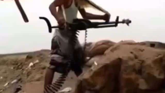 Genius insurgent attempts to fire a hand-held DSHK